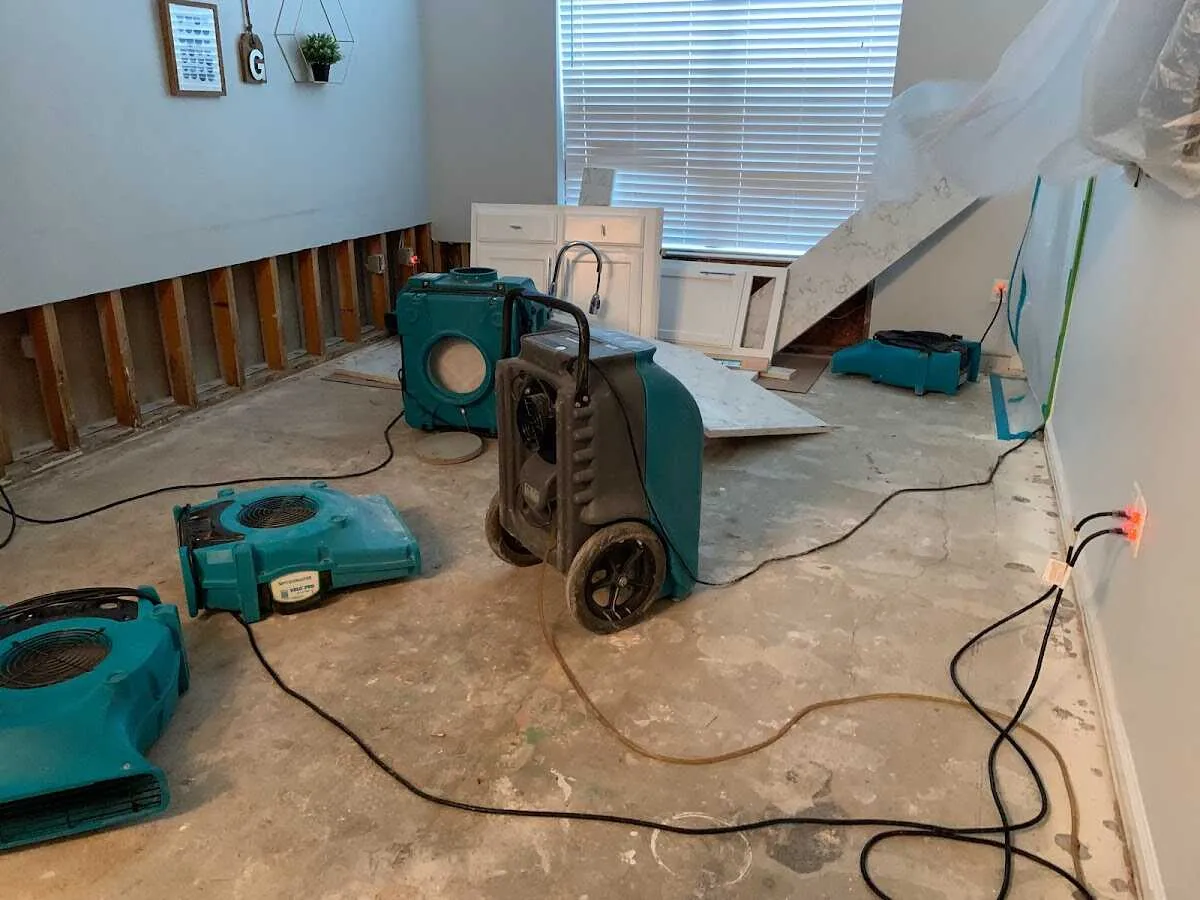 Dehumidifier in flood-cut room for Water Damage Restoration in Huron
